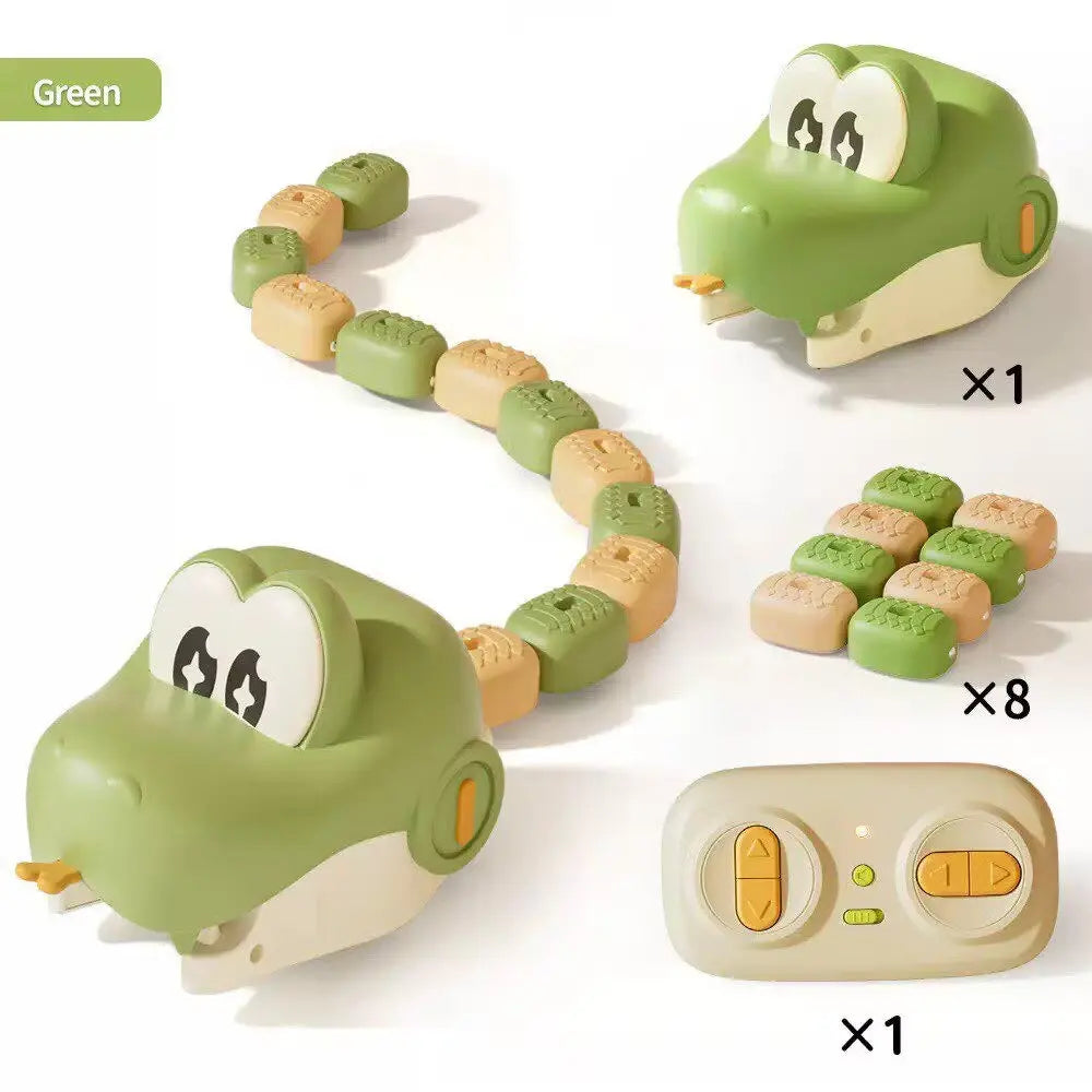 A green and cream robotic snake toy set shown on a white background, including two crocodile-head robots, a beige remote control, and multiple small square food pieces. A green label in the top left reads 'Green' and quantity multipliers x1, x8, and x1 appear beside the components.