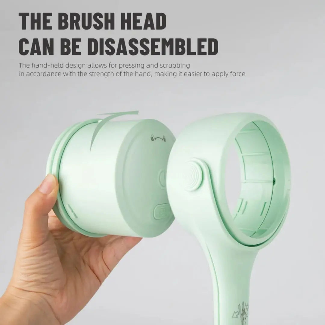Green handheld scrubber with disassembled brush head on a gray background