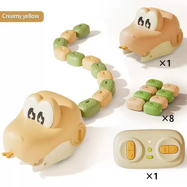 A snake-shaped baby teething toy set in creamy yellow and green, shown with its remote control and a small stack of textured pieces on a white background. A text label reads 'Creamy yellow' and quantity multipliers x1, x8, and x1 are printed next to the items.